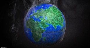 A picture taken on November 10, 2015 shows a small globe surrounded by smoke to illustrate global warming. France will be hosting and presiding the 21st Session of the Conference of the Parties to the United Nations Framework Convention on Climate Change (COP21/CMP11), also known as Paris 2015 from November 30 to December 11. AFP PHOTO / LIONEL BONAVENTURE        (Photo credit should read LIONEL BONAVENTURE/AFP/Getty Images)