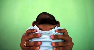 Jackeline  26  holds her son who is 4-months old and born with microcephaly  in front of their house in Olinda  near Recife  Brazil  in this February 11  2016 file photo  Evidence is building for the theory that Zika can cause newborn brain defects  and the World Health Organization is promising more answers in weeks  but nailing a definitive link will be neither simple nor swift  Picking apart numerous potential connections between mothers who show evidence of infection with the mosquito-borne virus and babies born with microcephaly  in which the head is abnormally small  will require precision and patience  specialists say  To match Insight HEALTH-ZIKA MICROCEPHALY  REUTERS Nacho Doce Files        TPX IMAGES OF THE DAY