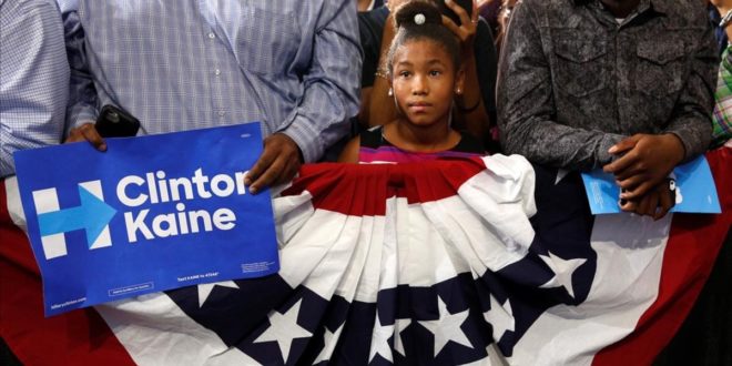 A young girl listens to U S  President Barack Obama speak at a Clinton-Kaine campaign rally at Florida Memorial University in Miami   October 20  2016    REUTERS Kevin Lamarque