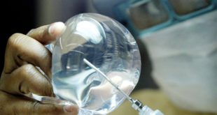 A laboratory worker of Silimed factory checks silicone in Rio de Janeiro  in this picture taken on March 27  2003  Apart from endowing with silicone eight out of every ten Brazilian women who choose to jump into a bigger bra  Silimed  as the Brazilian firm is called  exports 65 percent of its output and is the world s No 3 supplier of breast implants  This summer  Silimed will open a new plant capable of producing 500 000 silicone packs annually  more than three times the size of its current capacity of 150 000 pieces  as it prepares an assault on the U S  market-- the world s biggest  Picture taken March 27   REUTERS Sergio Moraes FEATURE LIFE-BRAZIL-BREASTS