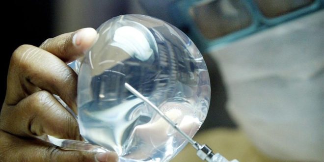 A laboratory worker of Silimed factory checks silicone in Rio de Janeiro  in this picture taken on March 27  2003  Apart from endowing with silicone eight out of every ten Brazilian women who choose to jump into a bigger bra  Silimed  as the Brazilian firm is called  exports 65 percent of its output and is the world s No 3 supplier of breast implants  This summer  Silimed will open a new plant capable of producing 500 000 silicone packs annually  more than three times the size of its current capacity of 150 000 pieces  as it prepares an assault on the U S  market-- the world s biggest  Picture taken March 27   REUTERS Sergio Moraes FEATURE LIFE-BRAZIL-BREASTS