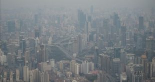 This picture taken on March 28  2017 shows residential buildings amid smog in Shanghai    AFP PHOTO   Johannes EISELE