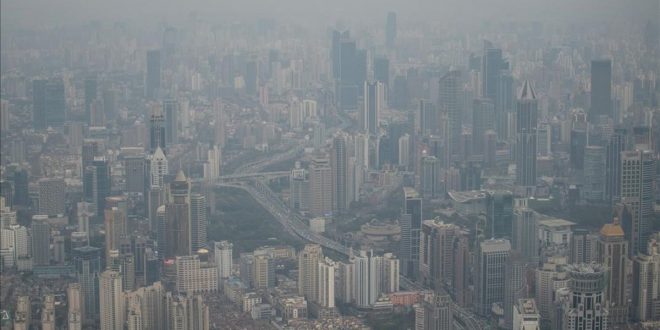 This picture taken on March 28  2017 shows residential buildings amid smog in Shanghai    AFP PHOTO   Johannes EISELE