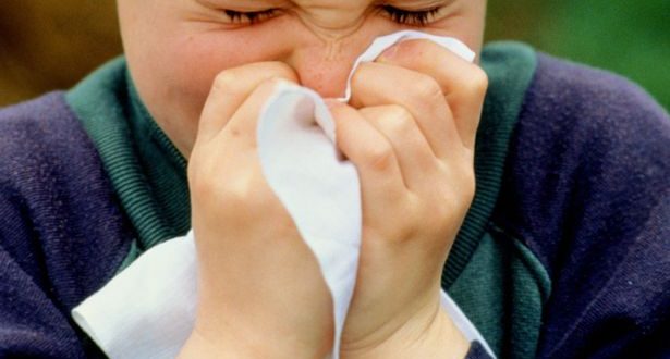 A-young-boy-sneezing