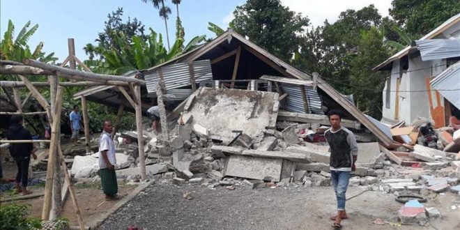 Villagers walk near destroyed homes in an area affected by the early morning earthquake at Sajang village  Sembalun  East Lombok  Indonesia  Sunday  July 29  2018  A shallow  magnitude 6 4 earthquake early Sunday killed at least 10 people and injured 40 on Indonesia s Lombok Island  a popular tourist destination next to Bali  officials said   AP Photo  Rosidin