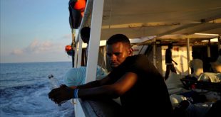 A migrant sits on board NGO Proactiva Open Arms rescue boat in central Mediterranean Sea  August 6  2018  REUTERS Juan Medina