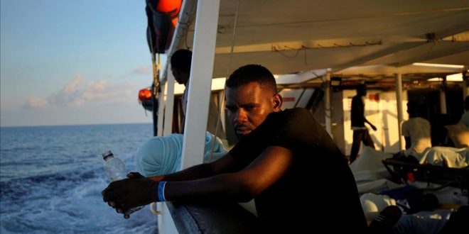 A migrant sits on board NGO Proactiva Open Arms rescue boat in central Mediterranean Sea  August 6  2018  REUTERS Juan Medina